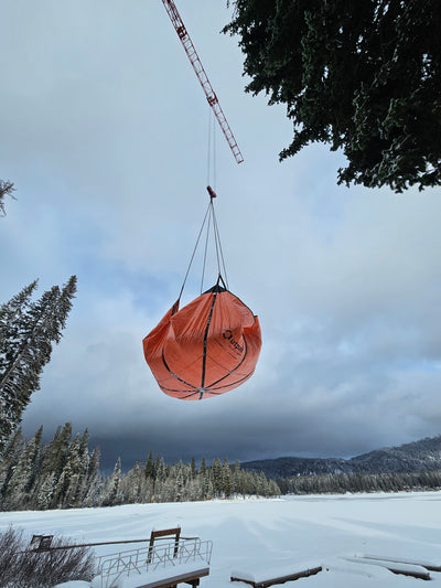 Airlifting an Outpak Sling Tarp loaded with snow.