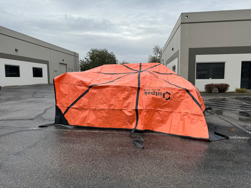 An Outpak debris tarp used to cover equipment at a warehouse.
