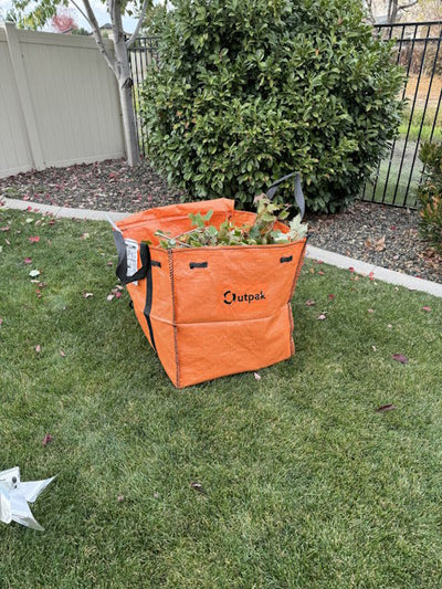 Outpak Debris Bag Mini with yard waste.