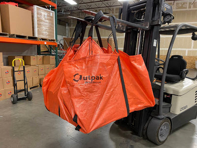 Outpak Sling Tarp carried by a forklift